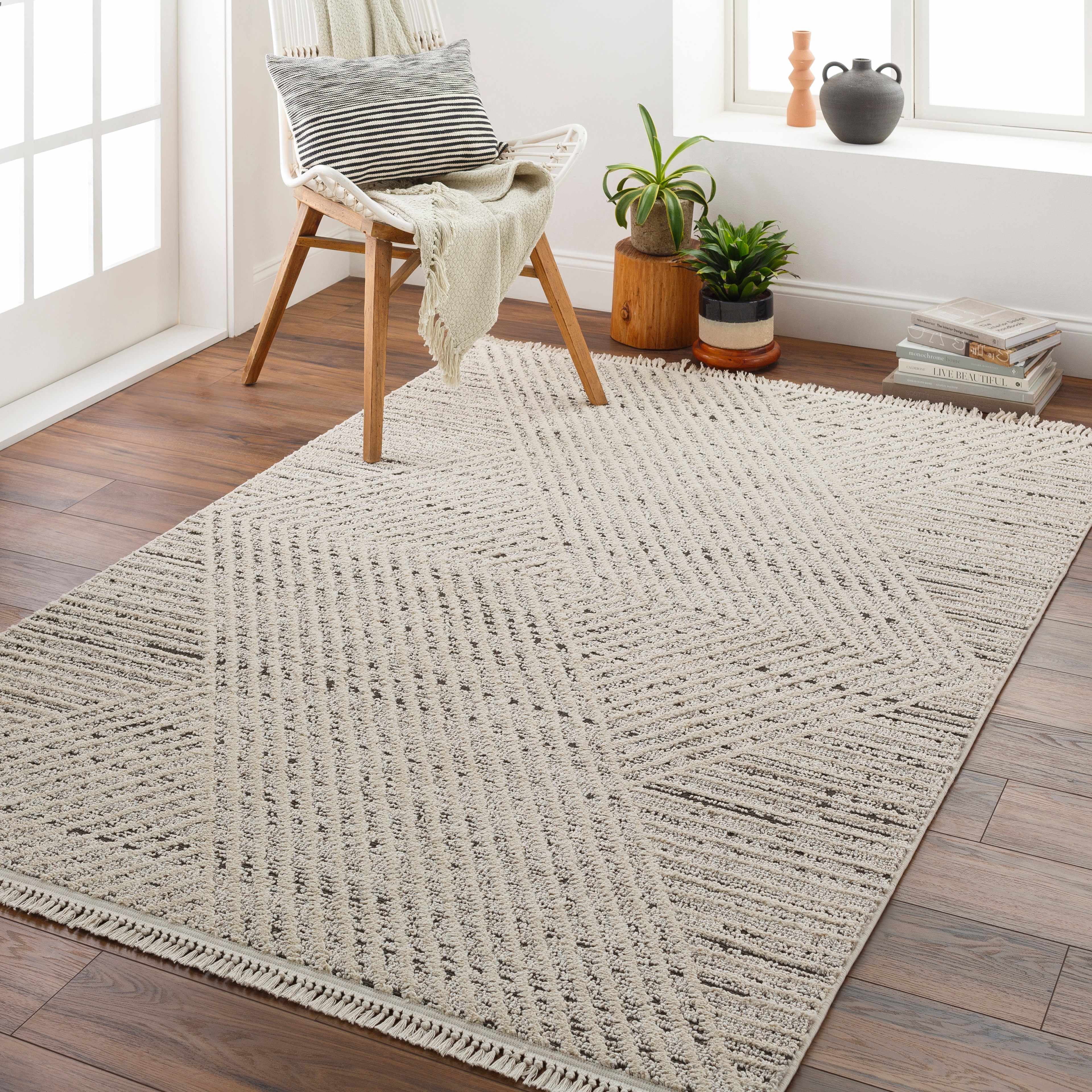 Brita 6'7in x 9' Area Rug - Hauteloom
