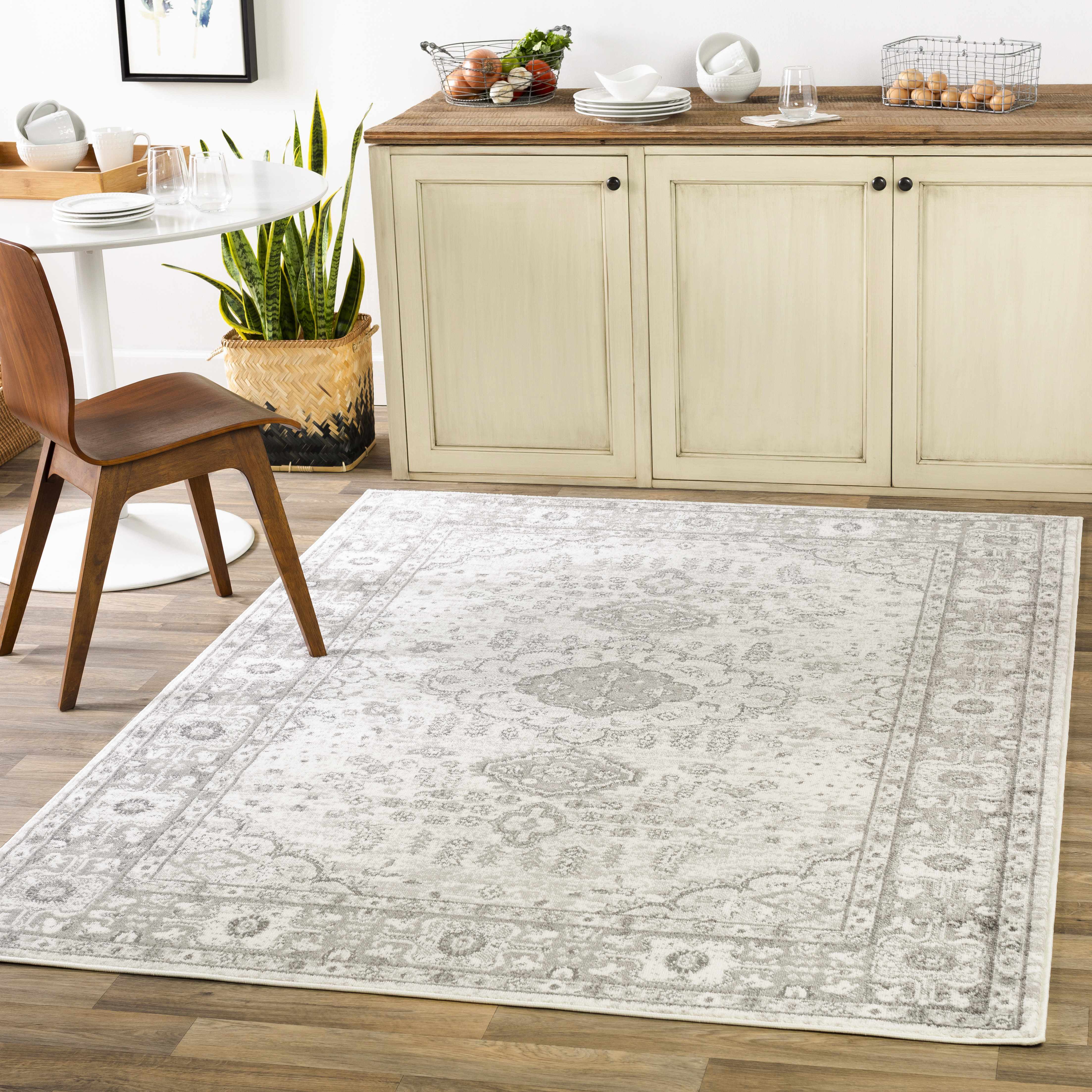 Rueter 6'7in x 9' Traditional Area Rug - Hauteloom